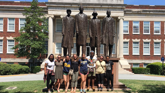 Pitt students at the statue of the Greensboro Four, on the campus of North Carolina A&T State University.