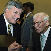 Nordenberg converses with Dan Rooney, chair of the Pittsburgh Steelers.