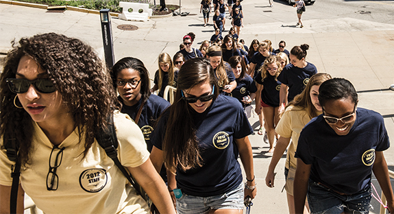 It was a hot, sunny day in August 2012 when members of Pitt’s Class of 2016 hiked up Desoto Street to the Petersen Events Center for Freshman Convocation. Part of the annual New Student Orientation week, the freshmen were grouped by residence hall and wore T-shirts with the name of their new homes. Today, those same students don graduation robes in preparation for Commencement 2016 in the Pete. What a journey it has been! 