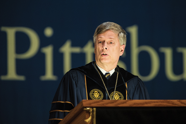Pitt Chancellor Mark A. Nordenberg address students during Aug. 22 Freshman Convocation in the Petersen Events Center. 