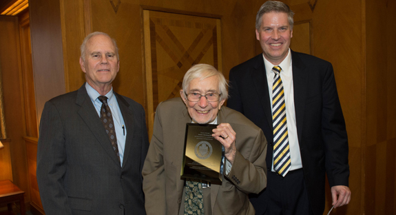 George A. Huber, Pitt vice provost for research conduct and compliance, with Jerome M. Rosenberg (center) and Chancellor Patrick Gallagher. Rosenberg retired from Pitt after 63 years of service.