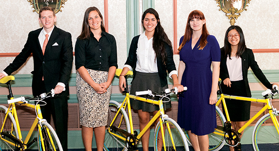 Members of the “Project Towers” team—Nicholas Hufnagel, Nuria Marquez, Bailey Lien, and Ken Arble—received bicycles as part of their award for winning Pitt’s 2014 Sustainable Solutions Competition. From left are, Hufnagel; Misti McKeehen, director, Office of PittServes; Marquez; Kacy McGill, Student Government Board Environmental Committee chair; and Lien. Not pictured are student Ken Arble (and his new bike).