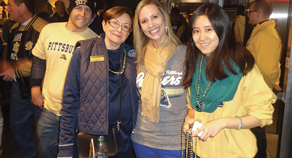 From left, Mimi Koral, director of alumni communications, Pitt Alumni Association; Kara Petro, director, Young Alumni and Student Programs, Office of Alumni Relations; and Yahui Lin, a graduate student in Pitt’s School of Education.