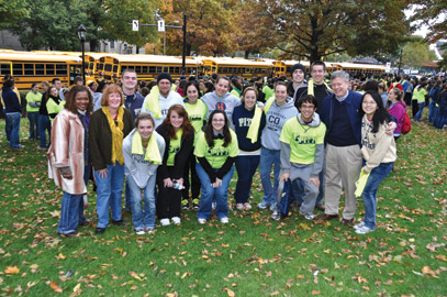 Kathy W. Humphrey (far left), Pitt vice provost and dean of students; Pitt Provost and Senior Vice Chancellor Patricia E. Beeson (beside Humphrey); and Chancellor Nordenberg (far right) pose with student volunteers. 