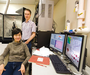 Jeremy Levy, a professor of physics and astronomy in Pitt’s School of Arts and Sciences, researches nanosize structures and hopes to advance the basic science that underlies quantum computing. He and Cheng Cen, who recently earned her PhD in Levy’s lab, are in front of an atomic-force microscope that is used to create the nanosize structures.  
