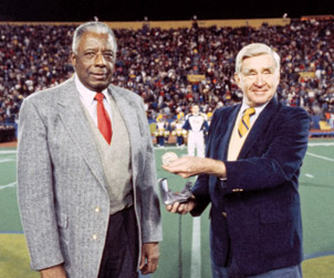 Pitt Chancellor Wesley W. Posvar presented John Woodruff with the University’s Distinguished Graduate Medal award in 1982. Eight years later, Woodruff donated his 1936 Olympic Gold Medal to Pitt during the halftime of a 1990 Pitt-Notre Dame game in the old Pitt Stadium. Posvar received the medal on the University’s behalf. Above, from left, Woodruff and Posvar.