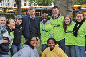 Pitt Chancellor Mark A. Nordenberg jokes with volunteers who gathered that morning.