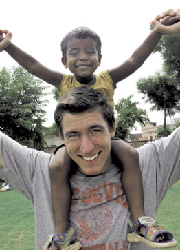 Pitt senior Michael Gowen with one of the children at the orphanage in Jaipur, India.