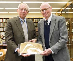 A rare 300-year-old letter written by one of history's most renowned philosophers was recently presented to University Library System (ULS) Director Rush Miller (on left) by Nicholas Rescher, Distinguished University Professor of Philosophy at Pitt and cochair of Pitt's Center for Philosophy of Science. The three-page letter, written in 1711, is the highlight of Rescher's massive collection of materials on philosophy he began donating to ULS last year. The letter was written by theologian Michael Gottlieb Hansch (1683-1749) to G.W. Leibnitz (1646-1716), the celebrated philosopher and mathematician who was an inventor of and contributor to calculus. Hansch was a biographer of German astronomer and astrologer Johannes Kepler (1571-1630). In the letter, Leibnitz asked several questions about Kepler's writings, but also touched upon other, theological matters, including divine justice, infant sin, and freedom of the will. A fourth page of the letter was left blank for Leibnitz's response. Leitnitz wrote back to Hansch, answering his questions and encouraging him to move ahead with publishing Kepler's manuscripts. The rare letter is now housed along with Rescher's other papers in Pitt's Archives of Scientific Philosophy. Rescher, who chaired the philosophy department at Pitt in 1980-81, has authored more than 100 books and hundreds of journal articles on many areas of philosophy.