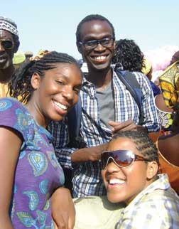 Pitt senior Sesi Aliu (center) on a ferry in The Gambia crossing the nation’s namesake river from the city of Barra to the capital of Banjul. Joining him were “hundreds of people, livestock, food, cars, and other goods.”