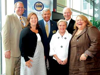 Pitt and sports: The ties that bind the Bigley and Smith families. Front row, from left, Cameron (Smith) Foos (EDUC ’03), Joan Bigley, and Georgia Smith (A&S ’70); back row, from left: David Foos (KGSB ’03), Jack Smith (A&S ’69, MED ’73), and Tom Bigley (KGSB ’56).    