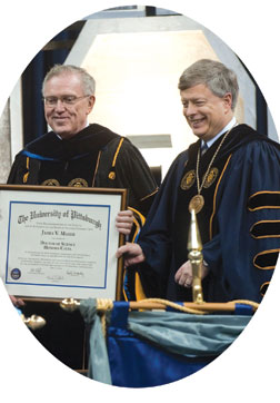 Pitt Chancellor Mark A. Nordenberg (right) surprised Provost and Senior Vice Chancellor James V. Maher by conferring upon him the Pitt honorary Doctor of Science degree. 