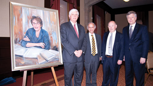 HONORING KATHERINE M. DETRE: A portrait of the late Katherine M. Detre, one of the nation’s leading epidemiologists, was unveiled during a June 9 reception in the University Club. At the time of her death in January 2006, Detre was a Distinguished Professor of Epidemiology in Pitt’s Graduate School of Public Health. During her career, she led groundbreaking large-scale studies on the effects of cholesterol-lowering drugs on coronary artery disease and cardiovascular risk factors in women, among other topics. From left are Donald S. Burke, GSPH dean; Arthur S. Levine, senior vice chancellor for the schools of the health sciences and dean of the School of Medicine; Lewis H. Kuller, Distinguished University Professor of Public Health; and Pitt Chancellor Mark A. Nordenberg. The portrait, which will be displayed in GSPH’s lobby in Parran Hall, was a gift to the school from two of Detre’s close friends.