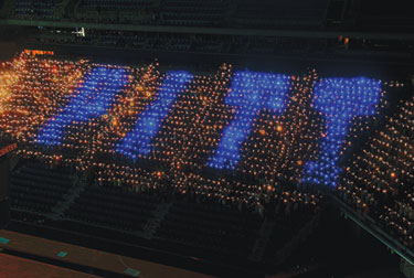 Forming the word P-I-T-T with blue flashlights, 2,496 new students gathered Aug. 26 in the Petersen Events Center in an attempt to break the Guinness World Record for the "World's Largest Torchlight (Flashlight) Logo/Image Formed by People."
