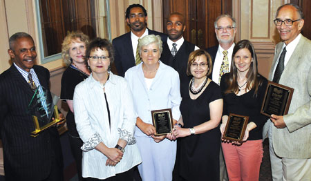 Members of Pitt’s Office of Public Affairs and Pitt History professor Laurence Glasco (far right) gathered for the 2010 Pittsburgh Black Media Federation annual Robert L. Vann Awards. From left, front row: Robert Hill, vice chancellor for public affairs; Jane-Ellen Robinet, Pitt Chronicle editor; Linda Schmitmeyer, senior director of news; Patricia Lomando White, senior news representative; Cara Hayden, senior editor, Pitt Magazine; and Glasco. From left, back row: Sharon Blake, senior news representative; Ervin Dyer, PBMF president and senior editor, Pitt Magazine; Anthony Moore, acting executive assistant to the vice chancellor; and John Harvith, senior associate vice chancellor, University News and Magazines.