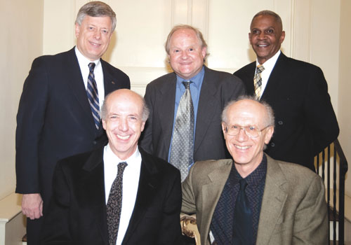 Jonathan and Peter Salk (seated, from left), two of Jonas Salk's sons, who came to the screening from California; Chancellor Nordenberg; Kurlander; and Vice Chancellor Hill (standing, from left).
