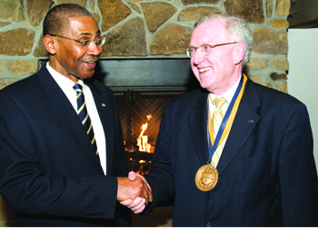 University of Pittsburgh Provost and Senior Vice Chancellor James V. Maher (right) received Pitt-Bradford’s Presidential Medal of Distinction from Livingston Alexander, Pitt-Bradford’s president (left). The presidential medal is Pitt-Bradford’s highest honor and was presented during a Feb. 22 tribute reception and dinner recognizing Maher’s significant support of Pitt-Bradford that has resulted in unprecedented growth for that campus. In November 2009, Maher announced that he would step down as the senior academic officer of the University, a post he has held since 1994; he plans to return to the faculty at the start of the 2010-11 academic year or as soon after that as his successor can be in place.