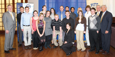 Pitt’s scholar-athletes with perfect 4.0 grade point averages (GPAs) gathered during the University’s March 4 Scholar-Athlete Awards Breakfast in Alumni Hall. The two women kneeling in front are Lauren Zammerilla (left) and Chrissy Colalillo. Second row, beginning from left with student in blue shirt, Zachary Mueller, Sarah Looney, Erin Meehan, Jonathan Buchanan, Philip Konieczny, Victoria Toso, and Justin Boehm. Back row, beginning with Provost and Senior Vice Chancellor James V. Maher on far left, Aaron Hassett, Meagan Dooley, Lauren Hartman, William (B.J.) Conklyn, Scott McKillop, Mycaiah Clemons, Healther Lezanic, Andrew Kalas, Pitt Athletic Director Steve Pederson, and Pitt Alumni Association President-elect Jack Smith.