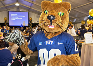 Roc the Panther joined Pitt student athletes and cheerleaders in greeting more than 900 Chancellor’s Circle donors and guests who attended the 2013 Chancellor’s Circle Celebration event in the big tent at Heinz Field before the Panthers faced off against the University of North Carolina on Nov. 16.