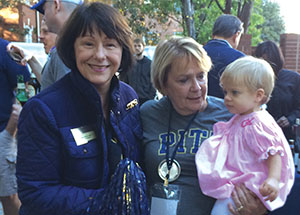 Jane Allred, president of the Pitt Alumni Association, with Winifred Allen-Coleman and her granddaughter.