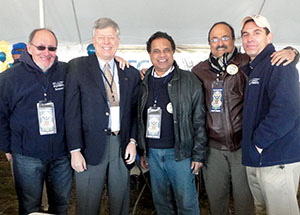 Colleagues in Pitt’s Swanson School of Engineering join Chancellor Nordenberg in the pregame-event tent in Annapolis. From left, Distinguished Professor of Bioengineering Harvey Borovetz, Chancellor Nordenberg, Distinguished Professor and Chair of Bioengineering Sanjeev Shroff, Professor of Bioengineering Pratap Khanwilkar, and Matt Weinstein, senior executive director of development and alumni relations.