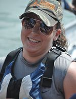 Top: Cocaptain Derek Dibert (left) and team member Eric Claycomb compete in the men’s endurance race at the National Concrete Canoe Competition, held at the University of Illinois at Urbana-Champaign. Above: Cocaptain Stephanie Buncich grins after a solid paddle in the women’s endurance race at nationals. Bottom: The 2012-2013 UPJ Concrete Canoe team poses with their concrete canoe Phantom, the pirate-themed boat that led the team to a regional championship and a spot at the National Concrete Canoe Competition. From left: Mike Imgrund (team captain), Callie Wallace, Hillary Olsavsky, Emily Yeager, Nathan Beuschlein, Alex Keslar, Eric Claycomb, Stephanie Buncich (Cocaptain), Ashley Babik, Patrick Moon-Rhoades, Christopher Garaventa, Zachary Murray, John Frantz, Logan Corle, Patricia Wardy, Derek Dibert (Cocaptain). 