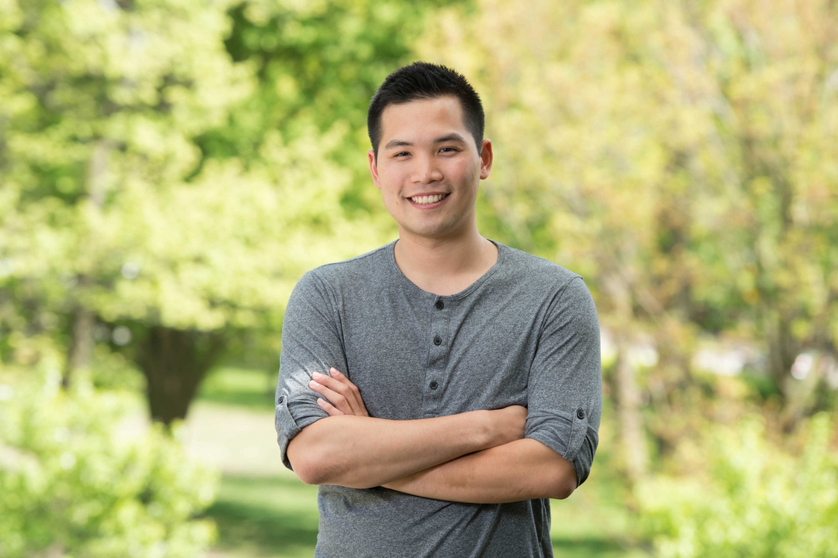 Chen in front of a green background