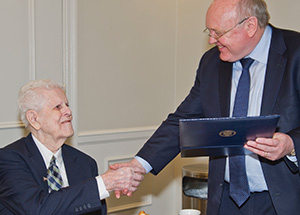 John Downs receives his diploma from N. John Cooper, the Bettye J. and Ralph E. Bailey Dean, Dietrich School of Arts and Sciences.