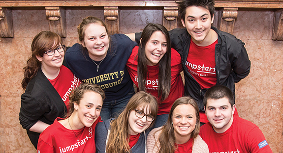 Pitt students enjoy a light-hearted moment in the midst of cleaning and scrubbing a children’s activity room in the Braddock Carnegie Library.