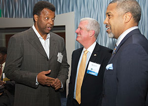 Alumnus Billy Knight (left)—legendary Pitt basketball player, former NBA star, and past executive vice president and general manager of the Atlanta Hawks—converses with Pitt Athletics Director Steve Pederson (center) and alumnus Adam Walker, a former Pitt Panther tailback who went on to play with the NFL’s San Francisco 49ers and Philadelphia Eagles.