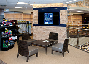 The new University Store on Fifth features a number of study areas (above) and display shelves that can be moved to make room for special events. The store is home to the Espresso Book Machine (below), a digital book production system that prints bound paperbacks in just minutes.