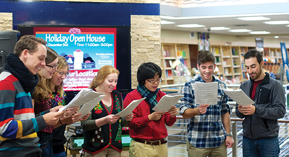 The University Store on Fifth held its Holiday Open House Dec. 3, hosting the Pitt Pendulums a cappella group as well as offering gift basket raffles, special sales, makeovers, and snacks and beverages. For the second year, the University Store is donating a portion of all in-store purchases through Dec. 14 to charities, including United Way and Project Bundle-Up, which provides new winter outwear for disadvantaged children and seniors across Western Pennsylvania. Project Bundle-Up is sponsored by WTAE-TV and The Salvation Army. (Photos by Emily O'Donnell)