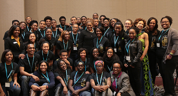 Pitt students played key roles in the National Society of Black Engineers (NSBE) Region II Fall Conference, held Nov. 14-16 at the DoubleTree Hilton in Greentree. Conference organizers included Pitt seniors Ashley McCray (far left with orange blouse), a chemical engineering major and the NSBE Region II chair, and Marcus Jordan (not pictured), an industrial engineering major and NSBE Fall Regional Conference chair. Pitt Vice Provost and Dean of Students Kathy Humphrey (center) delivered remarks on leadership and the importance of having passion for one’s profession to more than 700 students from around the region. Prior to the conference, Pittsburgh Mayor Bill Peduto declared Nov. 14 as National Society of Black Engineers Day. 