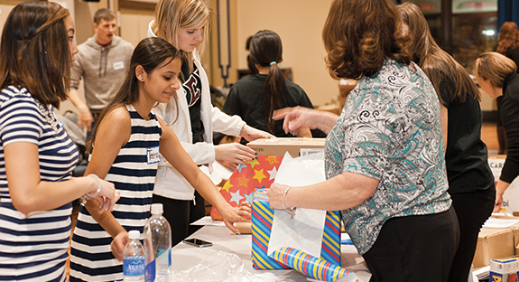 The Genocide Relief and Awareness Club, a Pitt student organization, gathered donated items—and attracted about 110 student and community volunteers—to assemble welcome kits for 17 refugee families who have been resettled in Pittsburgh. The club received a $250 grant, which they used to spearhead the effort dubbed the Pitt Good Neighbor project. The donations of goods related to kitchen, school, infant-care, and hygiene needs were sorted and put into welcome kits on Jan. 22 at the William Pitt Union. Pitt student Shamanta Mostofa, founder of the Genocide Relief and Awareness Club, said the club coordinated the effort with the Northern Area Multi-Service Center of Allegheny County, a nonprofit that assists with refugee resettlement, and hopes to do the project annually. (Photo by Emily O'Donnell)