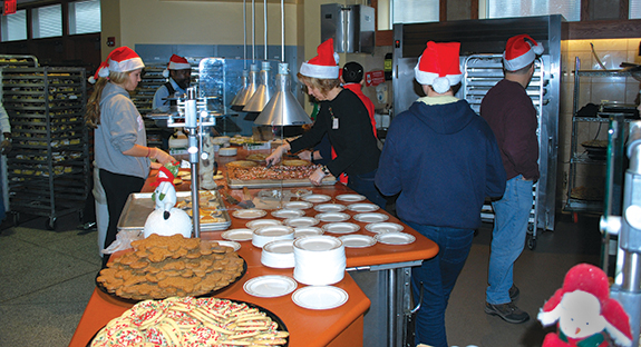 An estimated 2,300 members of the Pittsburgh community enjoyed a complete holiday meal on Dec. 25 in Pitt’s Market Central dining hall beneath Litchfield Towers. For the ninth year, individuals in need or alone were invited to attend the event, which is sponsored annually by Pitt and its food services provider Sodexo, in conjunction with the Salvation Army of Western Pennsylvania. Santa makes an appearance—and so do more than 200 volunteers from the Pitt community and their families