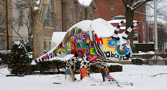 Even the dinosaurs are shivering as winter white covers Oakland. “Alphabetasaurus” rests in front of Saint Nicholas Greek Orthodox Cathedral at the corner of Forbes Avenue and South Dithridge Street. The colorful creature is one of several hundred dinosaur statues that were created and placed all over Pittsburgh during the 2003 Dinomite Days, which raised money for the Carnegie Museum of Natural History. The Grable Foundation sponsored Alphabetasaurus, and the students and teachers at Pittsburgh’s Phillips Elementary School designed and painted the dinosaur’s lettered exterior (Photo by Emily O'Donnell)