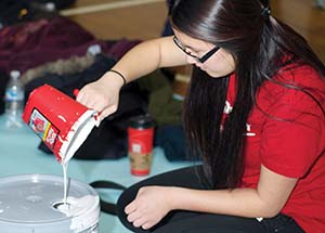 Students painted rooms inside Hosanna House, a community center in Wilkinsburg.