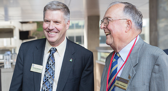 Chancellor Patrick Gallagher (left) with alumnus John A. Swanson, an emeritus trustee, during a May 20 celebration marking the completion of a $150 million renovation to the Benedum Hall of Engineering. The evening was hosted by Gallagher and Gerald D. Holder, U.S. Steel Dean of Engineering. In December 2007, Pitt’s engineering school was named “The John A. Swanson School of Engineering” in recognition of Swanson’s extraordinarily generous giving to the University and the school. (Photo by John Altdorfer)