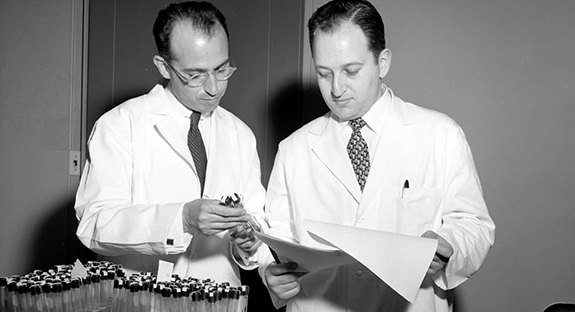 Jonas Salk, left, and Julius Youngner