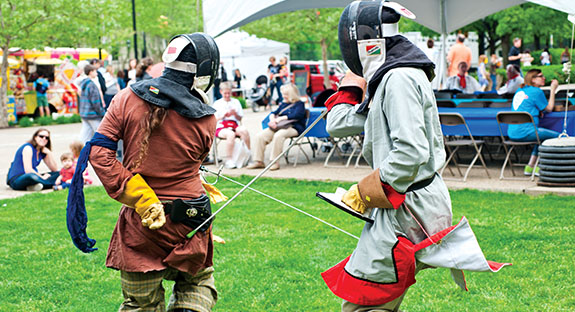 Fencers jousted on the green between Posvar Hall and Hillman Library as part of Pitt’s Europe Day Festival on May 7. The fencers are part of the Society for Creative Anachronism, an international organization that researches and recreates the arts and skills of pre-17th-century Europe. The festival was hosted by Pitt’s European Studies Center, part of the University Center for International Studies. The day featured artisans, food booths, cultural performances, and children’s activities. (Photo by Emily O'Donnell)