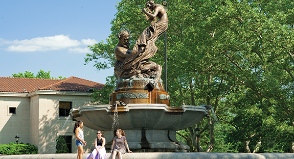 Last week’s hot sunshine and a fountain’s cool water provided the perfect enticements to go barefoot and rest upon the fountain’s edge. Hot weather has finally arrived, and the Mary Schenley Memorial Fountain—in front of the Frick Fine Arts Building—is the perfect backdrop for a momentary pause. The 1918 bronze-and-granite sculpture, also known as A Song to Nature, features a reclining Pan, the Greek god of shepherds, and a female singer above him playing a lyre. (Photo by Emily O'Donnell)