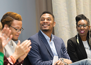 Poets Terrance Hayes, a Pitt professor of English, and Lyrae Van Clief-Stefanon, Cornell associate professor of English, (in photo, center and far right) listen during a March 21 evening of performances and discussions by six accomplished Black poets, sponsored by the University of Pittsburgh Press and the new Center for African American Poetry and Poetics. (Photo by Aimee Obidzinski/Pitt CIDDE)