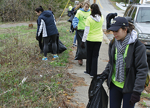 Volunteers help clean up trash for Pitt Make a Difference Day.