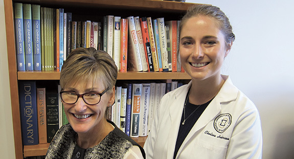 Professor Susan Meyer, left, with her student, Chelsea Henderson, who is completing a Doctor of Pharmacy degree at Pitt.  “Pharmacists need scientific expertise,” says Henderson, “but they also care for people in the community. As a pharmacist, my role first is as a member of the community, and that works well with what I value personally.”