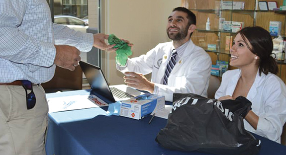 POUNDS OF UNUSED MEDICINE: About 185 pounds of expired and unused medication were collected during the Pitt Pharmacy Drug Take-Back Day on Sept. 11. About 100 members of the University community and public dropped off medications to Pitt Police and School of Pharmacy doctoral student volunteers in Nordenberg Hall. The expired and unused medications are vulnerable to misuse and theft and contribute to environmental contamination if disposed of improperly. The drugs were picked up and destroyed by the federal Drug Enforcement Administration. From left are 3rd-year School of Pharmacy student volunteers Alex Marshall and Karley Fazzone.