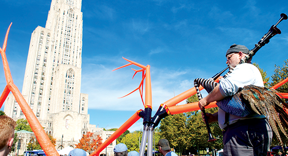 Oakland celebrated its 175th anniversary by hosting a community party in and around Schenley Plaza on Oct. 10-11. Pitt was the lead sponsor for the event, which featured free museum admissions, art and photography exhibits, family fun, food trucks, and live music. Pictured is Steve O'Hearn of Squonk Opera, performing for the crowd. 