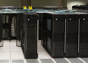 The Bridges supercomputer comprises several refrigerator-sized cabinets, each containing multiple processors. 
