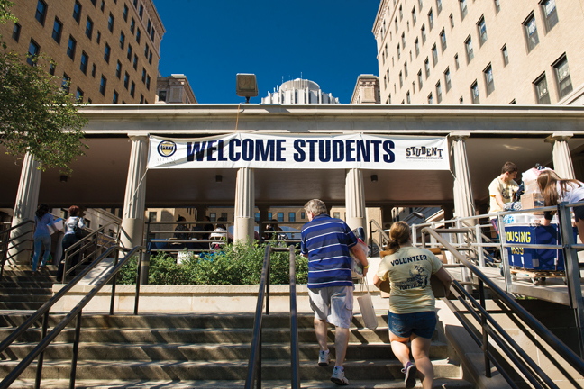 Pitt Arrival Survival volunteers help families move boxes near Schenley Quad. 