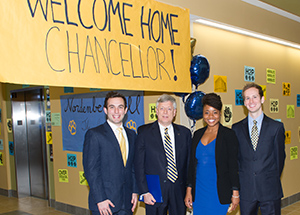 Chancellor Nordenberg is greeted by Nordenberg Hall resident assistants. From left, Timothy Boros, Chancellor Nordenberg, LaVonda Baldwin, and Max Schuster.