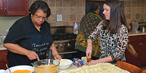 Members of Pitt's Staff Association Council serve dinner to residents of the University Club's Family House in December 2011.